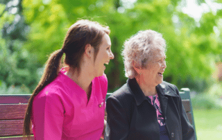 Caregiver and client laughing