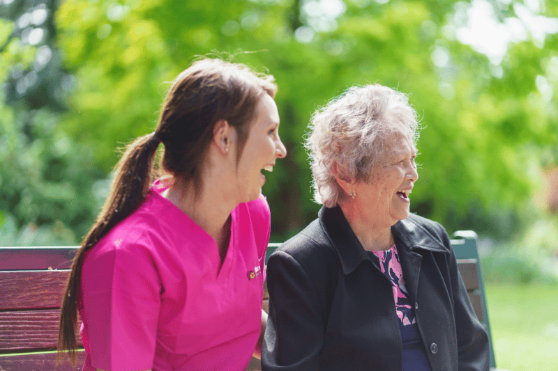 Caregiver and client laughing