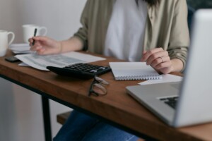 A person gathering documents for a grant proposal